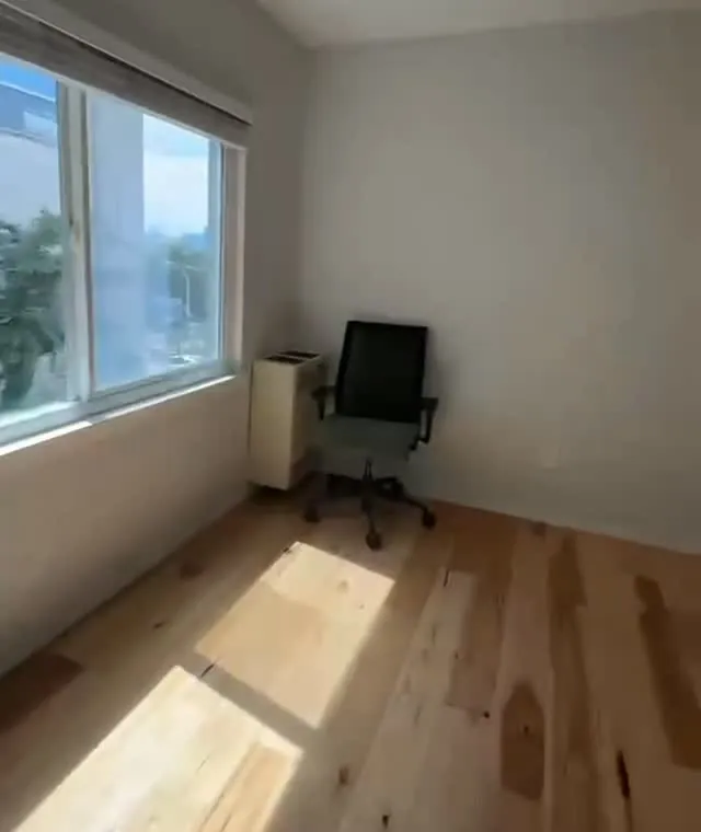 Empty room with sunlight on clean wood floor