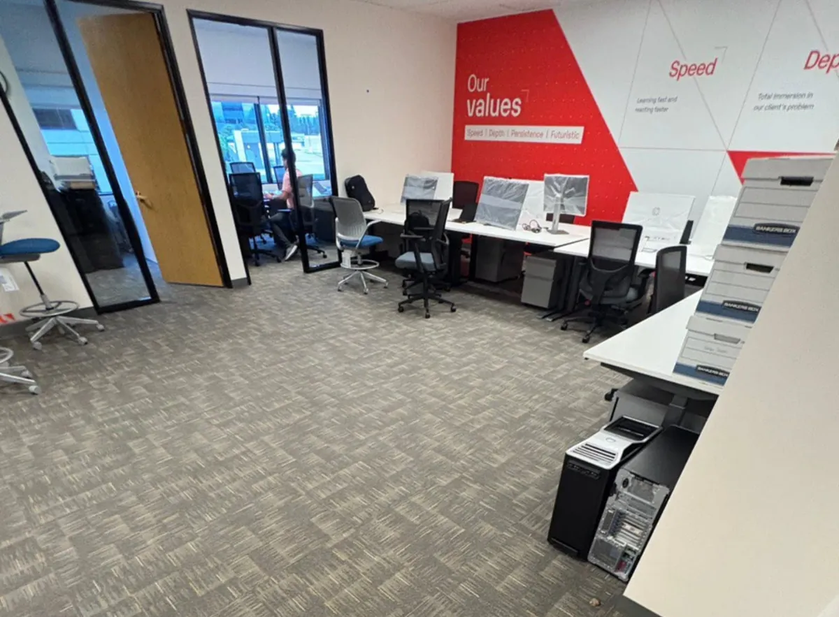 Office floor with carpet vacuumed and desks clear