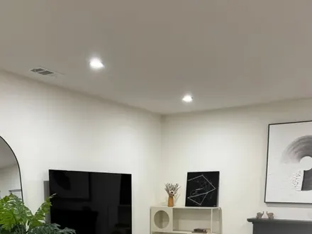 Tidy living room with fireplace and TV