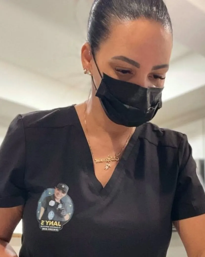 Jany's Cleaning team member wiping a kitchen counter